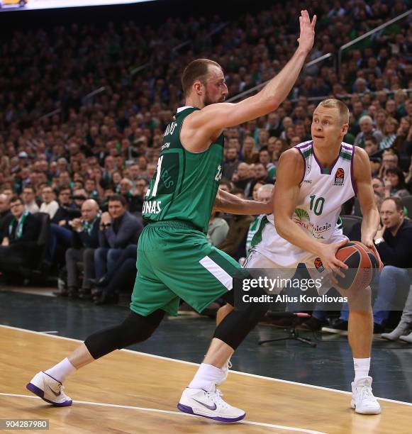 Sasu Salin, #10 of Unicaja Malaga competes with Arturas Milaknis, #21 of Zalgiris Kaunas in action during the 2017/2018 Turkish Airlines EuroLeague...