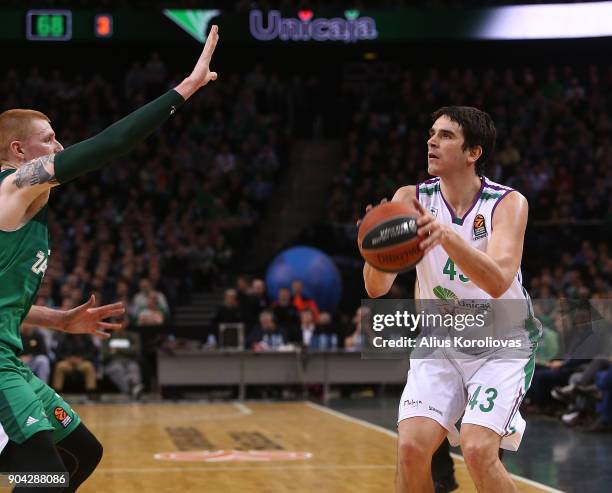 Carlos Suarez, #43 of Unicaja Malaga competes with Aaron White, #30 of Zalgiris Kaunas in action during the 2017/2018 Turkish Airlines EuroLeague...