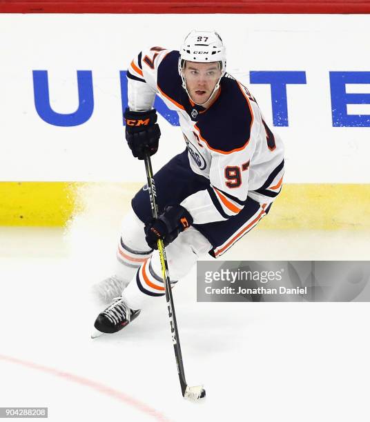 Connor McDavid of the Edmonton Oilers turns to pass the puck against the Chicago Blackhawks at the United Center on January 7, 2018 in Chicago,...
