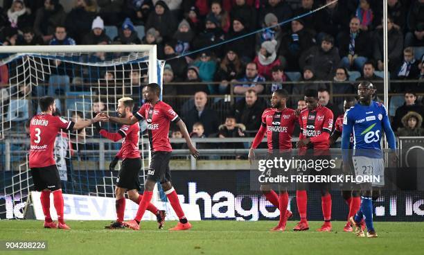 Guingamp's players jubilate during the French L1 football match between Strasbourg and Guingamp on January 12, 2018 at the Meinau stadium in...