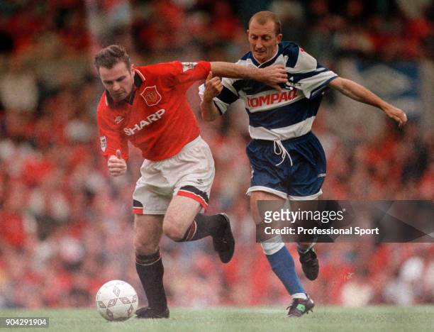 Brian McClair of Manchester United and Ian Holloway of Queens Park Rangers in action during the FA Carling Premiership match at Old Trafford on...