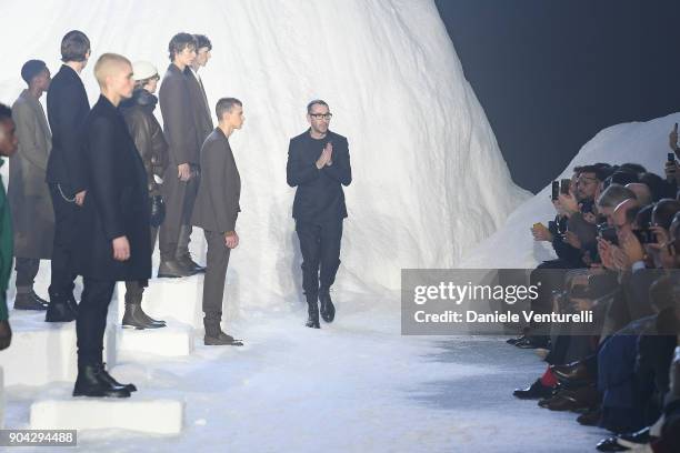 Designer Bruno Frisoni aknowledge the applause of the public after the the Ermenegildo Zegna show during Milan Men's Fashion Week Fall/Winter 2018/19...