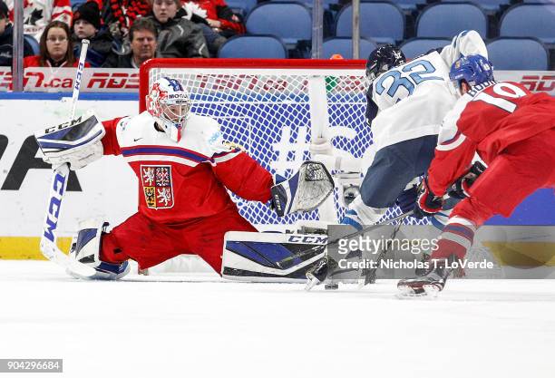 Josef Korenar of Czech Republic makes a save against Aleksi Heponiemi of Finland during the first period of play in the IIHF World Junior...