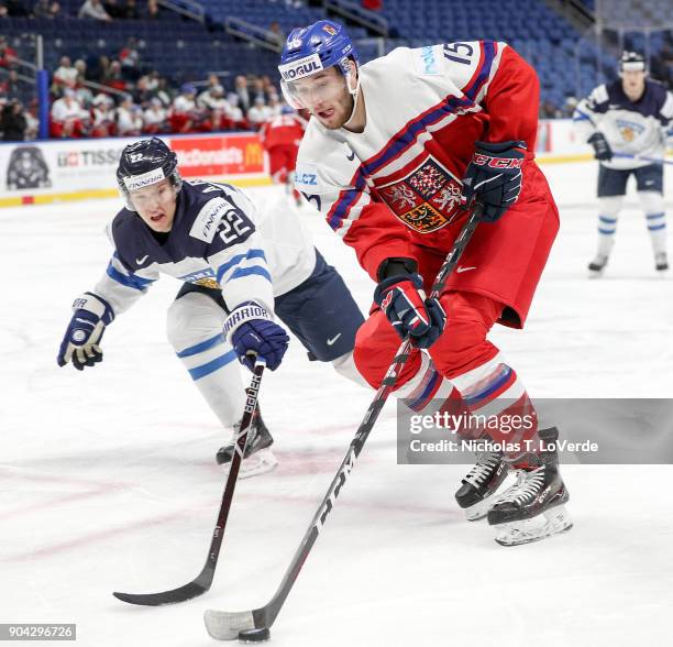 Daniel Kurovský of Czech Republic skates against Aapeli Räsänen of Finland during the first period of play in the IIHF World Junior Championships...