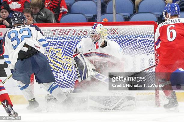 Josef Korenar of Czech Republic defends his net against Aleksi Heponiemi of Finland during the third period of play in the IIHF World Junior...