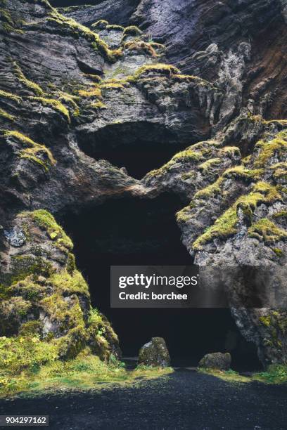 entrance to the cave gygajga in iceland - cave entrance stock pictures, royalty-free photos & images