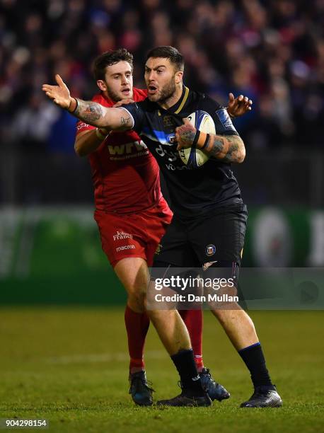 Matt Banahan of Bath remonstrates with Referee, Jerome Garces as Dan Jones of Scarlets tries to retrieve the ball during the European Rugby Champions...