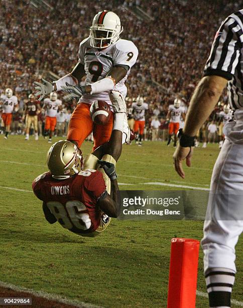 Defensive back Sam Shields of the Miami Hurricanes knocks the ball away from wide receiver Rod Owens of the Florida State Seminoles during a goal...