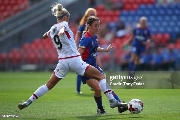 Adriana Jones of Adelaide contests the ball with Clare Wheeler of the Jets during the round 11 W-League match between the Newcastle Jets and Adelaide...