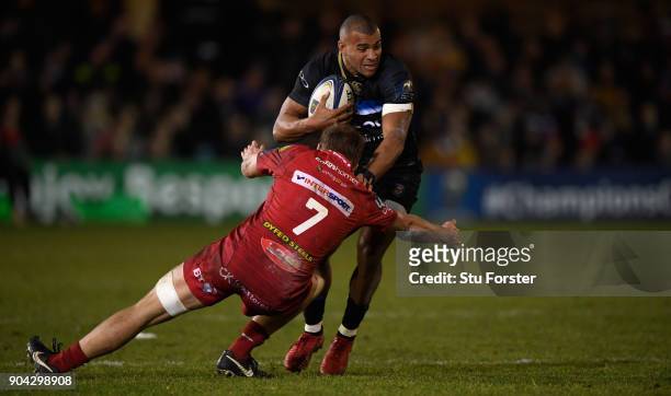 Bath centre Jonathan Joseph runs into Scarlets player James Davies during the European Rugby Champions Cup match between Bath Rugby and Scarlets at...