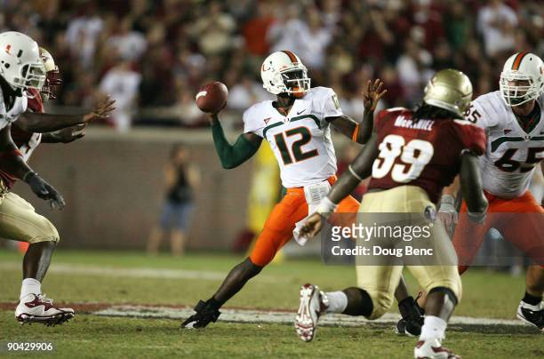 Quarterback Jacory Harris of the Miami Hurricanes throws a touchdown pass in the fourth quarter to Graig Cooper against the Florida State Seminoles...