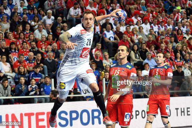 France's Valentin Porte shoots on goal during the preliminary round group B match of the Men's 2018 EHF European Handball Championship between France...