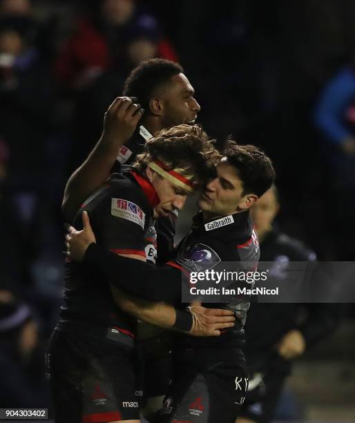 Hamish Watson of Edinburgh Rugby is congratulated on scoring a try by team mate Sam Hidalgo-Clyne during the European Rugby Challenge Cup match...