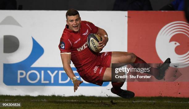 Scarlets player Scott Williams goes over for the bonus point fourth try during the European Rugby Champions Cup match between Bath Rugby and Scarlets...