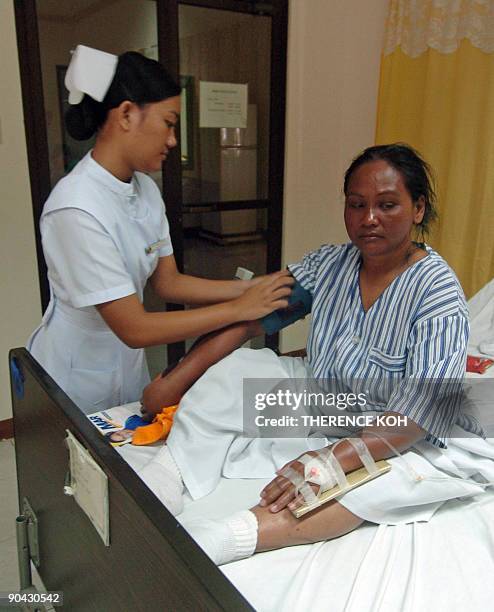 Lita Casumlon , a survivor of the ill-fated 'Superferry 9' that sank in southern Philippine waters with nearly 1,000 people on board off the...