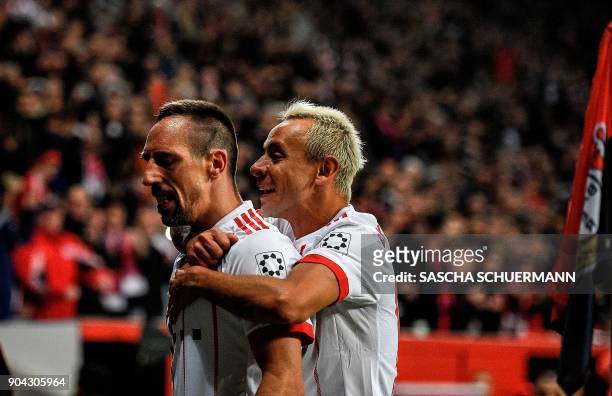 Bayern Munich's French midfielder Franck Ribery celebrates scoring with Brazilian defender Rafinha during the German First division Bundesliga...