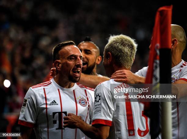 Bayern Munich's French midfielder Franck Ribery celebrates scoring with his teammates during the German First division Bundesliga football match...