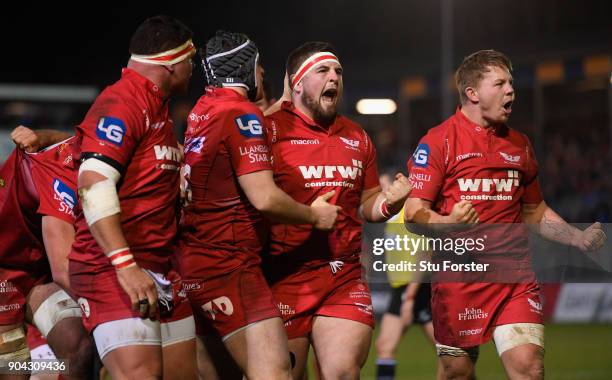 Scarlets players Wyn Jones and James Davies celebrate after forcing a penalty out of Bath during the European Rugby Champions Cup match between Bath...