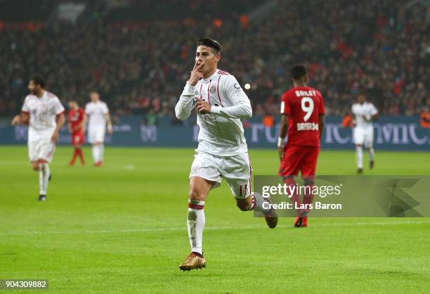 James Rodriguez of Bayern Muenchen celebrates as he scores their third goal from a free kick during the Bundesliga match between Bayer 04 Leverkusen...