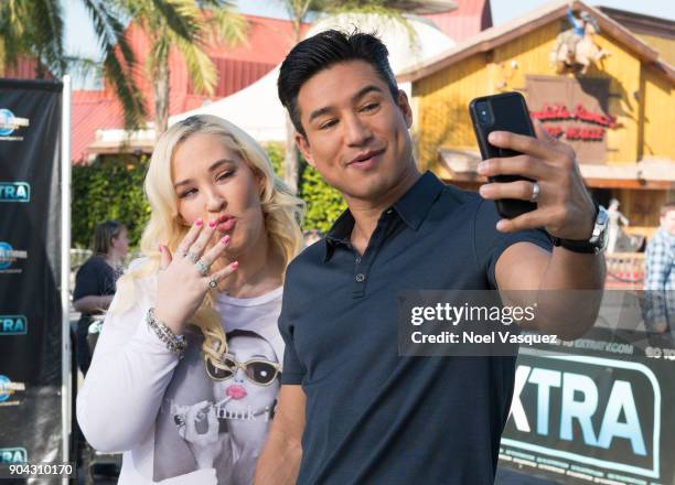 June Shannon takes a selfie with Mario Lopez at "Extra" at Universal Studios Hollywood on January 11, 2018 in Universal City, California.