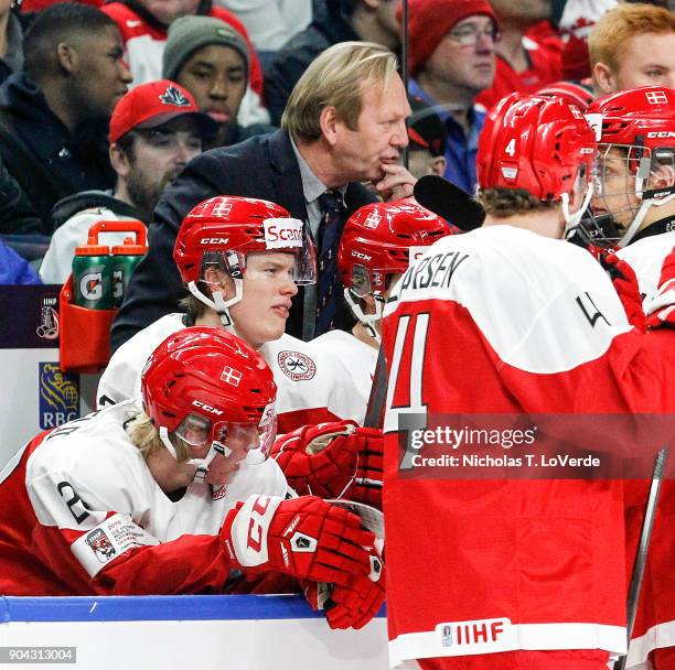 Denmark head coach Olaf Eller behind the Denmark bench during the first period of play against Canada in the IIHF World Junior Championships at the...