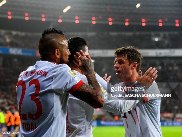 Bayern Munich's midfielder James Rodriguez celebrates after scoring with his teammates during the German First division Bundesliga football match...
