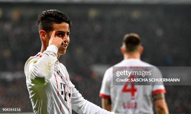 Bayern Munich's midfielder James Rodriguez celebrates after scoring during the German First division Bundesliga football match Bayer Leverkusen vs FC...