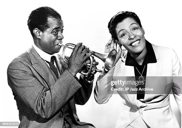 Louis Armstrong and Billie Holiday pose together for a studio portrait c 1939.