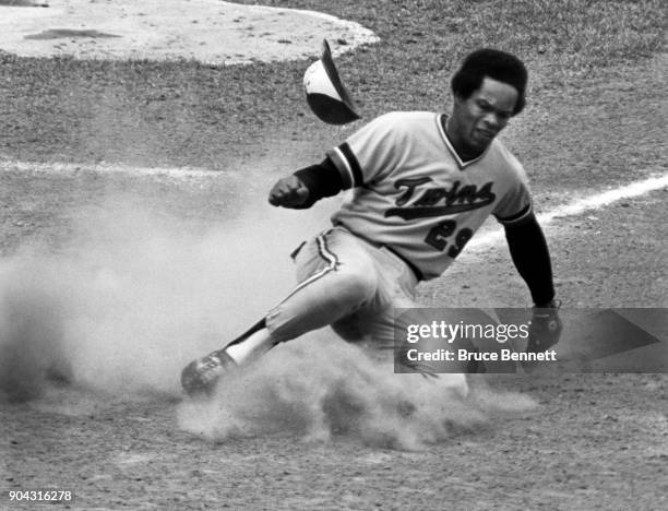 Rod Carew of the Minnesota Twins slides safely into home during an MLB game against the New York Yankees circa 1978 at Yankee Stadium in the Bronx,...