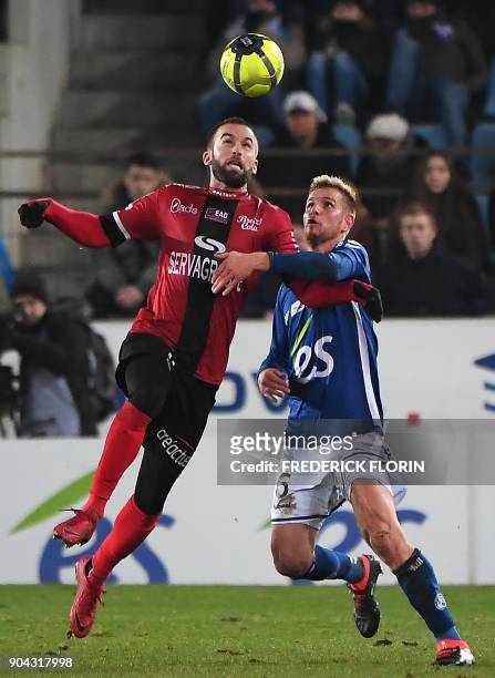Strasbourg's French midfielder Jeremy Grimm vies with Guingamp's French midfielder Lucas Deaux during the French L1 football match between Strasbourg...