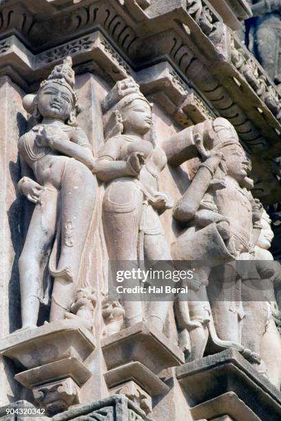 stone carvings of beautiful women on the kandariya mahadev temple - khajuraho statues stock pictures, royalty-free photos & images