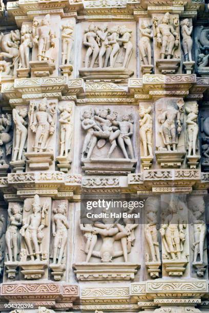erotic stone carvings on the kandariya mahadev temple - khajuraho statues stock pictures, royalty-free photos & images