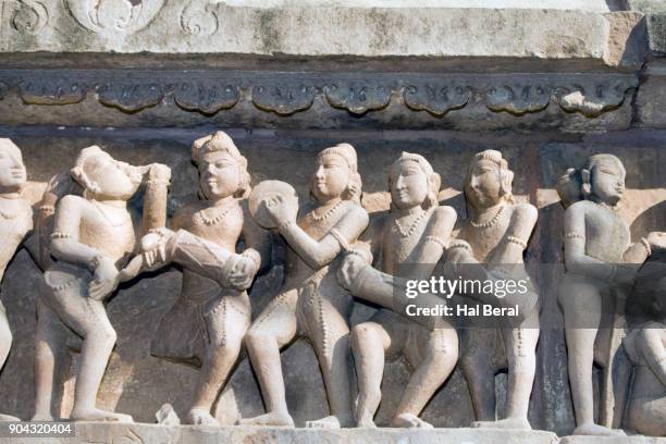 stone carving on lakshmana temple showing musicians - khajuraho statues stock pictures, royalty-free photos & images
