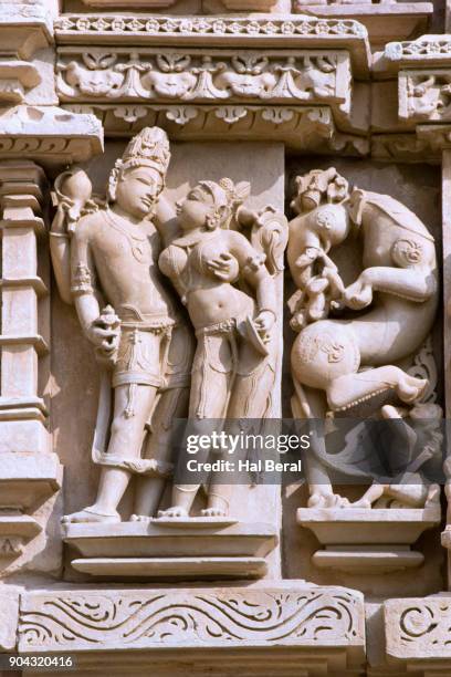 stone carvings on the parsvanath temple - khajuraho statues stock pictures, royalty-free photos & images