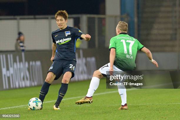 Genki Haraguchi of Hertha and Uffe Bech of Hannover battle for the ball during the H-Hotels.com Wintercup match between Hertha BSC and Hannover 96 at...