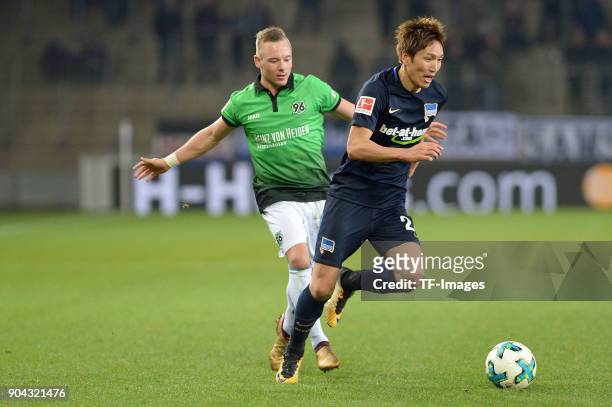 Uffe Bech of Hannover and Genki Haraguchi of Hertha battle for the ball during the H-Hotels.com Wintercup match between Hertha BSC and Hannover 96 at...