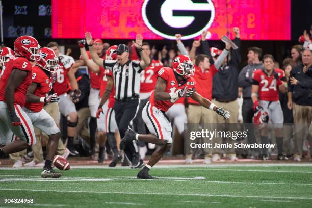 Deandre Baker of the Georgia Bulldogs celebrates after intercepting a pass against the Alabama Crimson Tide during the College Football Playoff...