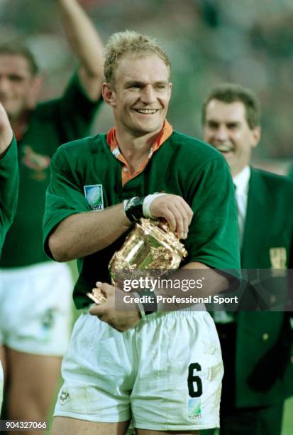 Francois Pienaar of South Africa with the trophy following their 15-12 victory in the Rugby Union World Cup Final against New Zealand at the Ellis...