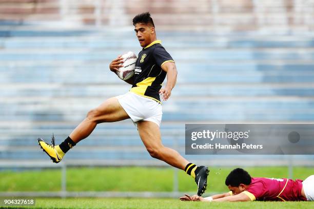 Levi Harmon of Wellington makes a break during the Bayleys National Sevens match between Wellington and Southland at Rotorua International Stadium on...