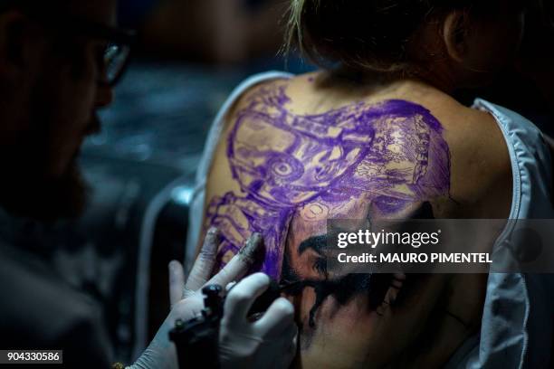 Woman has a tattoo of Jack Sparrow - a character from the film Pirates of the Caribbean - done, during the annual Tattoo Week in Rio de Janeiro,...