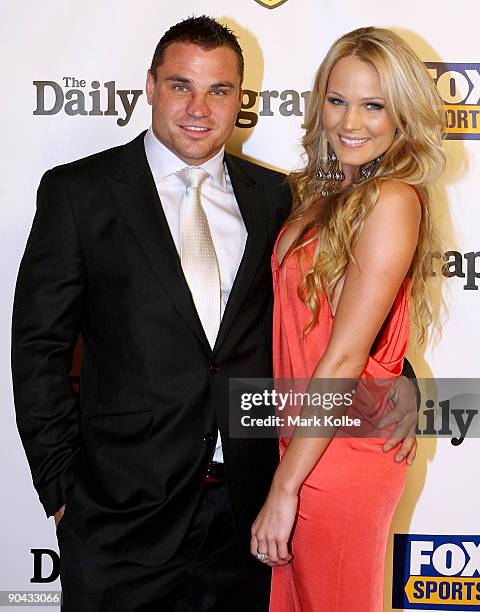 Anthony Watmough and Brooke Cullen pose on the red carpet as they arrive at the 2009 Dally M Awards held at the State Theatre on September 8, 2009 in...