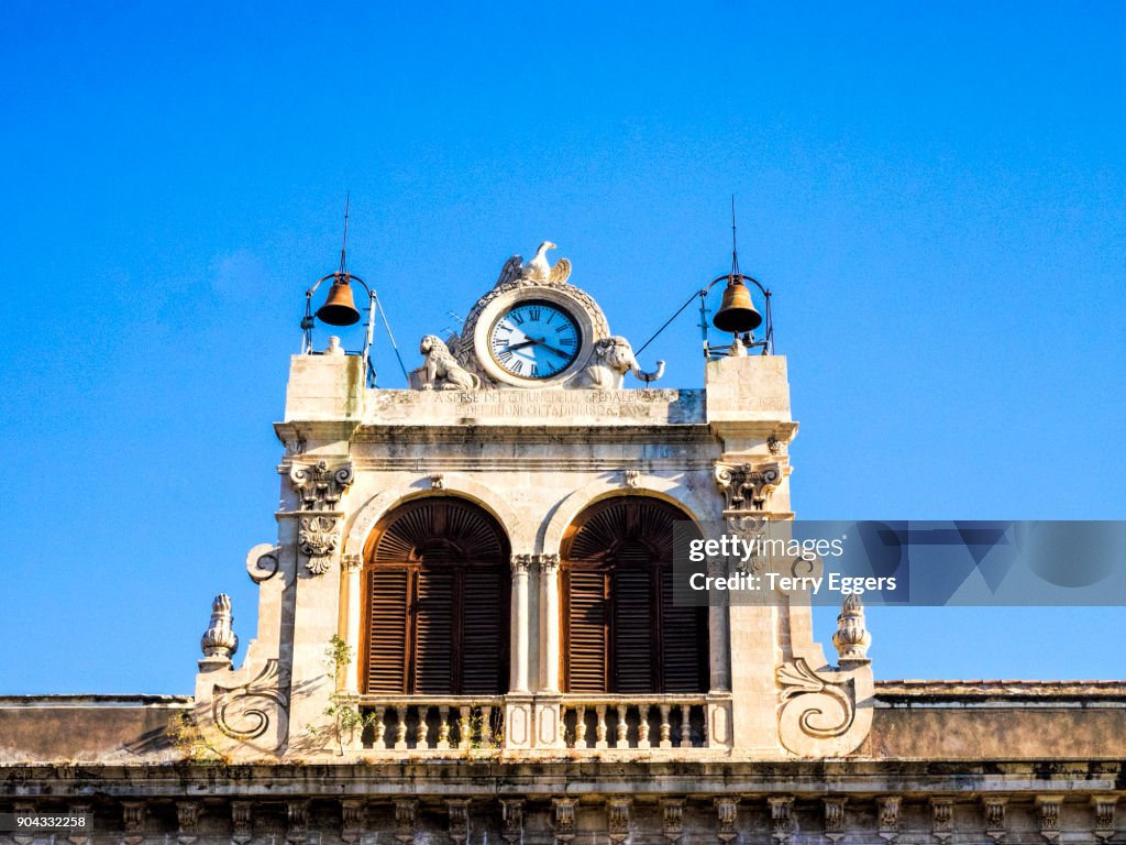 The clock tower of Palazzo Tezzano in Piazza Stesicoro.