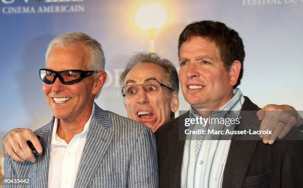 Directors Jim Abrahams, Jerry Zucker and David Zucker pose during the photocall for their tribute during the 35th Deauville Film Festival on...