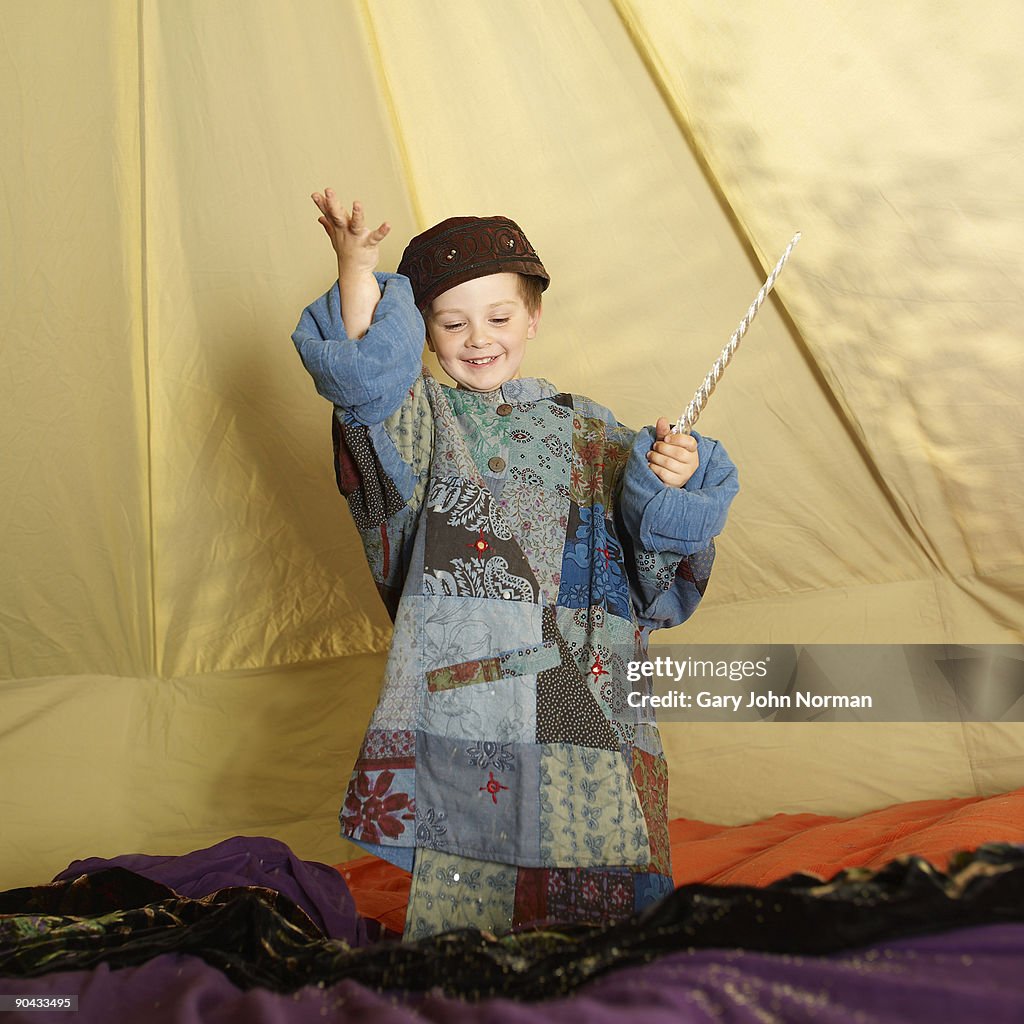 Young boy dressed as a wizard