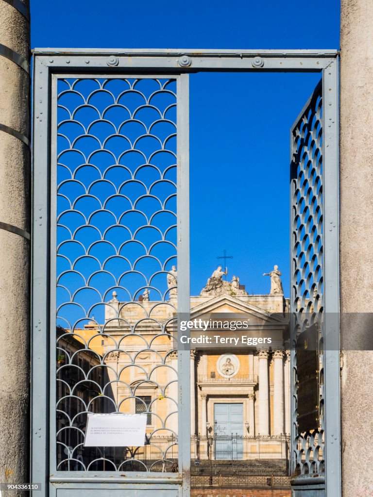 Looking through the gate at the Saint Biagio Church of Catania on Piazza Stesicoro.