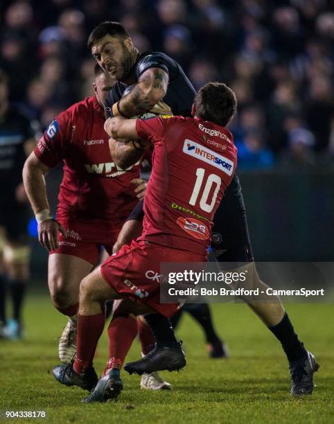 Bath Rugby's Matt Banahan is tackled by Scarlets Dan Jones during the European Rugby Champions Cup match between Bath Rugby and Scarlets at...