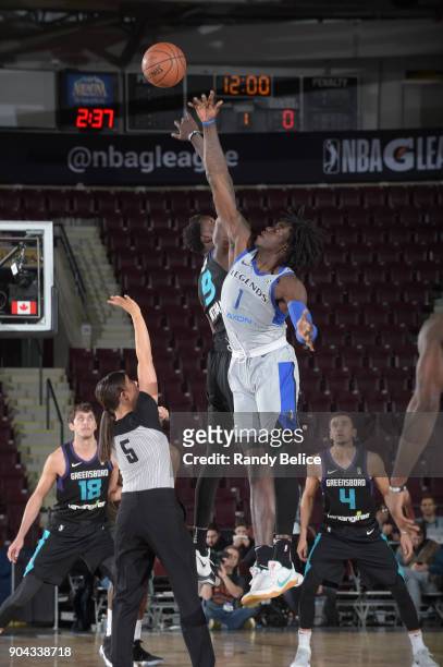 Tip off between Johnathan Motley of the Texas Legends and Mangok Mathiang of the Greensboro Swarm at NBA G League Showcase Game 17 on January 12,...