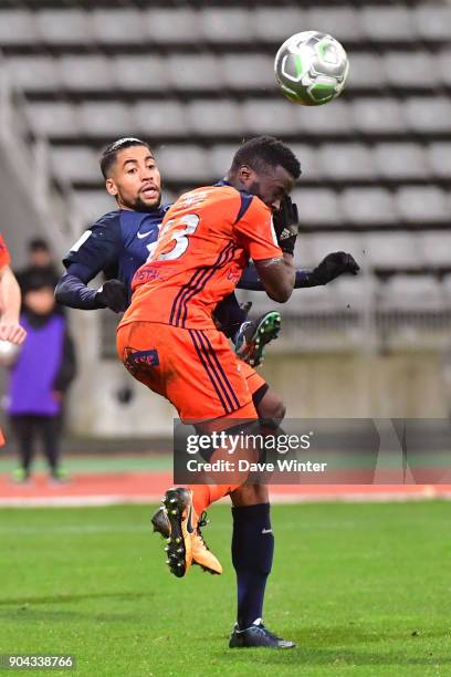 Saifeddine Alami Bazza of Paris FC and Pape Abdou Paye of FBBP 01 during the Ligue 2 match between Paris FC and Bourg en Bresse at Stade Charlety on...