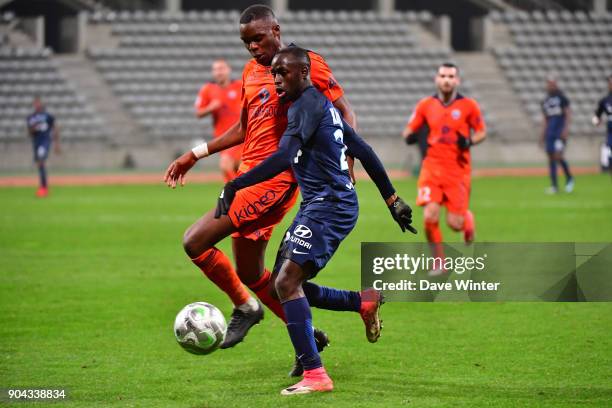 Souleymane Karamoko of Paris FC and Christopher Martins Pereira of FBBP 01 during the Ligue 2 match between Paris FC and Bourg en Bresse at Stade...