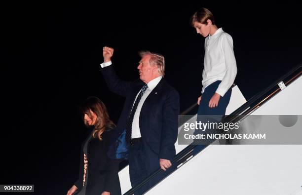 President Donald Trump, son Barron and wife Melania step off Air Force One upon arrival at Palm Beach International Airport in West Palm Beach,...